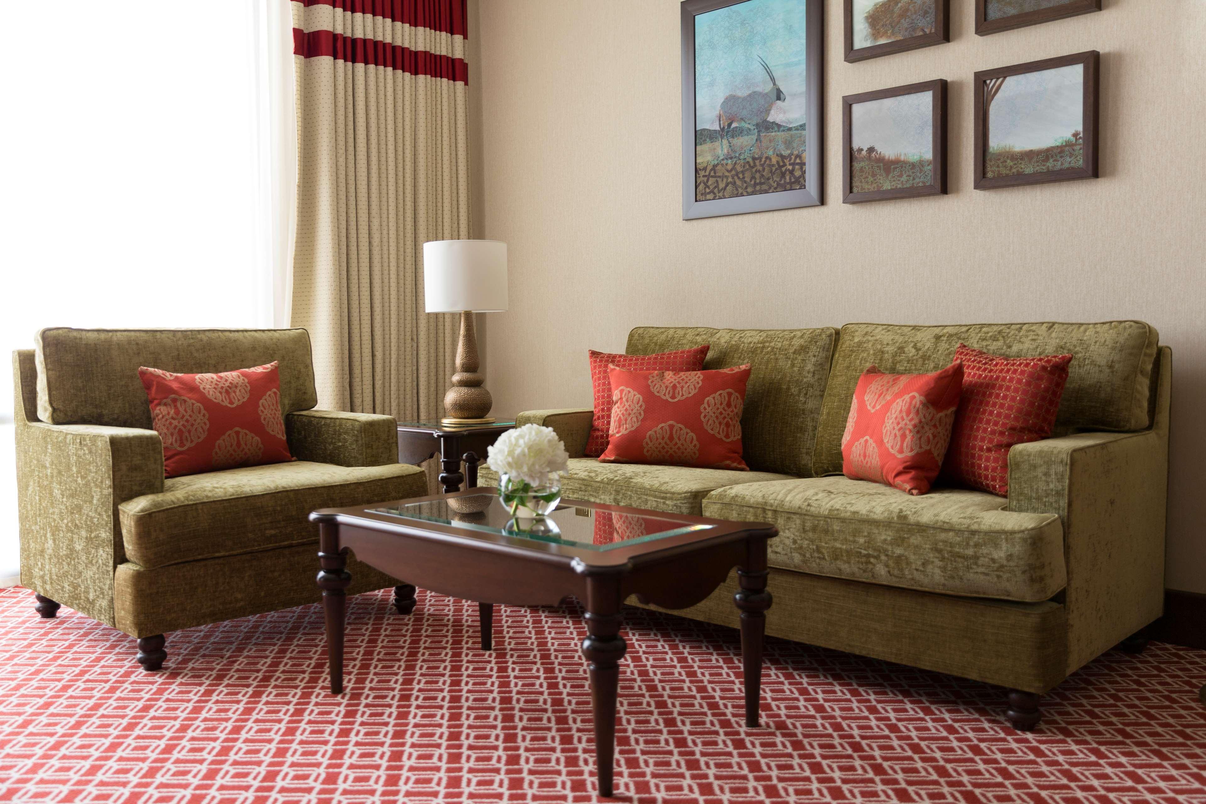 Al Najada Doha Hotel By Tivoli Exterior photo A living room