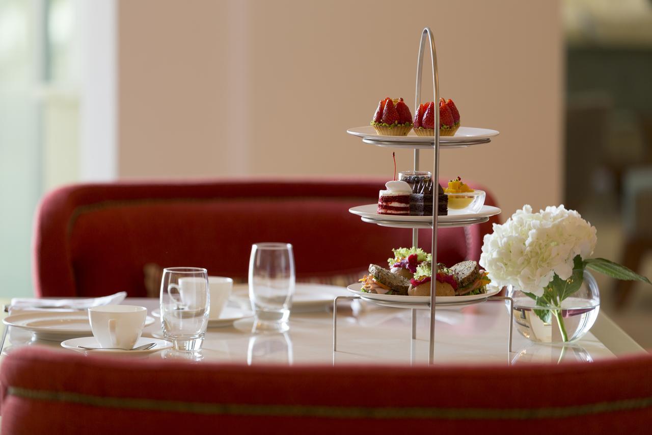 Al Najada Doha Hotel By Tivoli Exterior photo Afternoon tea at the Ritz-Carlton, DIFC, Dubai