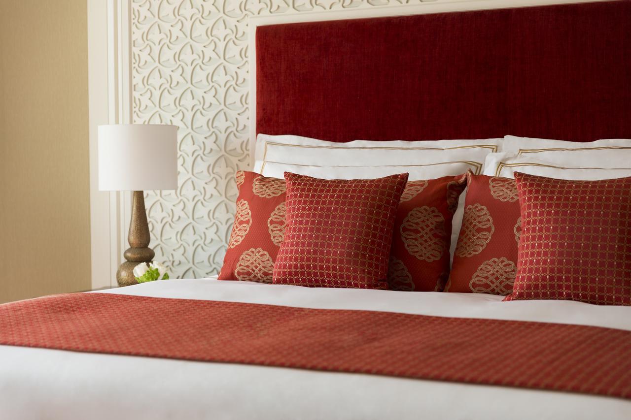 Al Najada Doha Hotel By Tivoli Exterior photo A bed with cushions